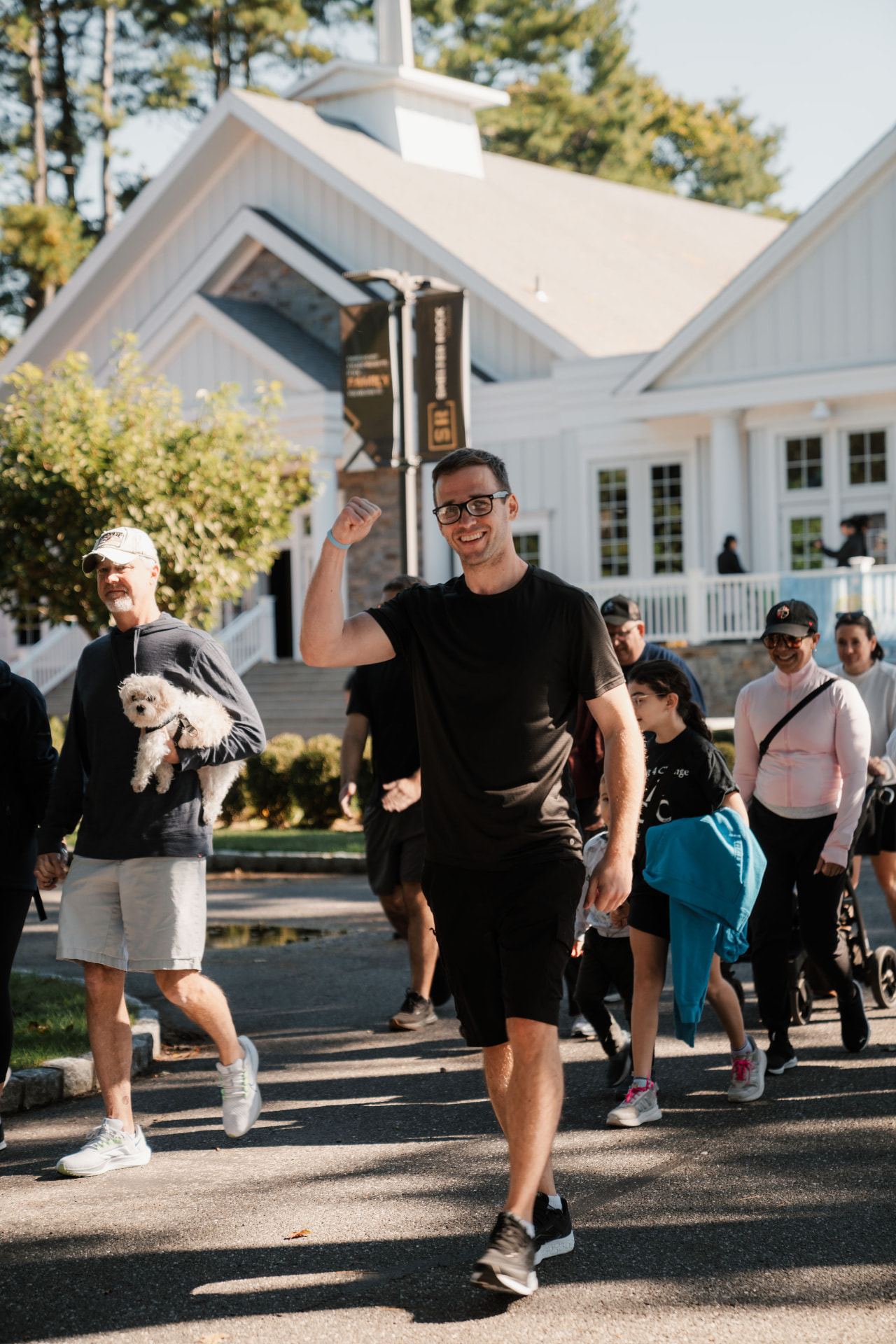 Walkers smiling as they head out on the course