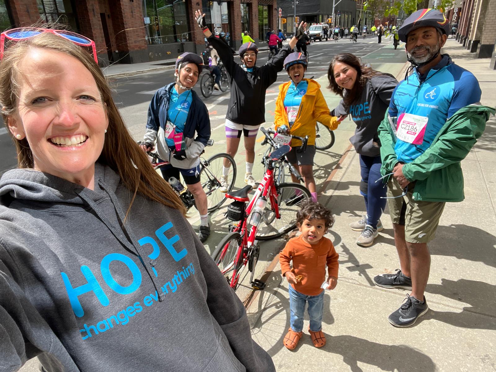Riders in Hope Changes Everything gear cheering before the ride